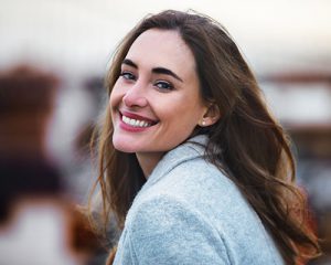 smiling woman after laser dentistry Santa Ana